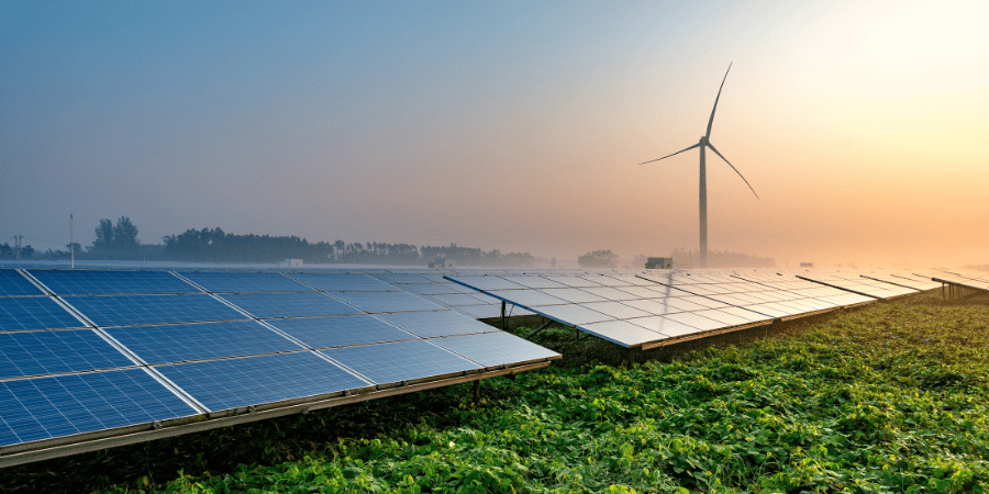 solar-farm-with-wind-turbine-in-background