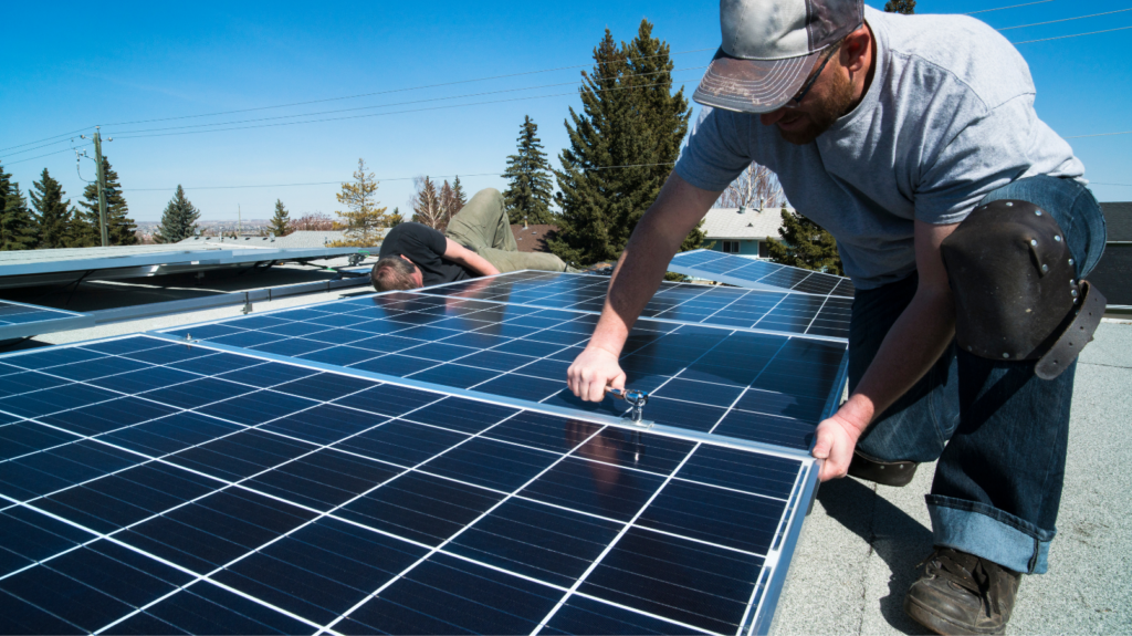 workers-installing-solar-panels-on-roof